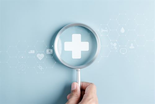 Patient Care. A plus icon in a lens. 